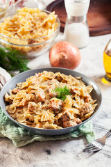 Creamy farfalle pasta with salmon, parmesan cheese and dill