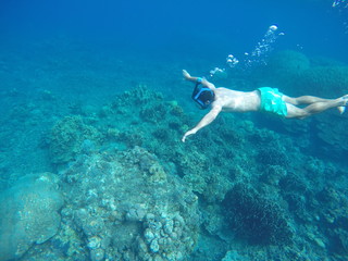 Snorkeling and underwater man
