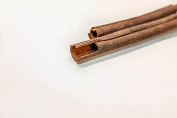 Top view of cinnamon sticks isolated on white. Fragrant cinnamon sticks