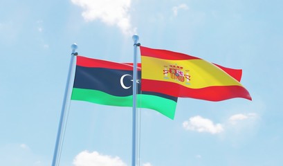 Spain and Libya, two flags waving against blue sky. 3d image