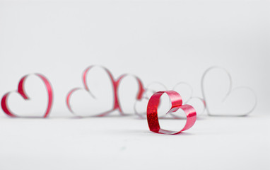 Ribbons shaped as hearts on white background, valentine day concept