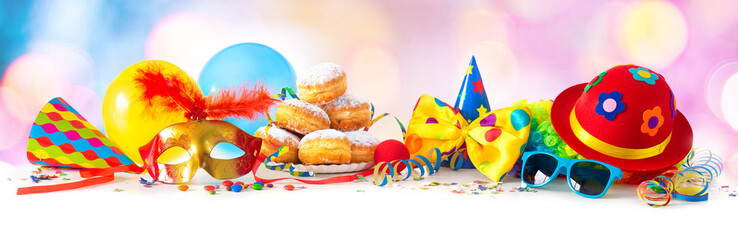 Carnival or party with donuts, balloons, streamers and confetti and funny face