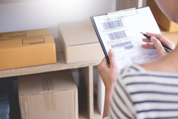 Businessman Shop owner  check Order or list inventory in stock which is going to be delivery room. business online, e-commerce concept.