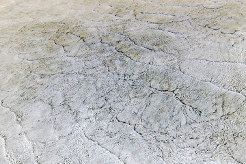 Textured white, yellow and gray sea waves pattern