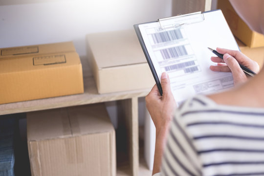 Businessman Shop owner  check Order or list inventory in stock which is going to be delivery room. business online, e-commerce concept.