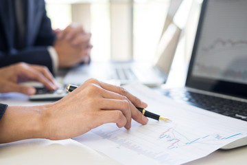 Business Team trader or broker Investment Entrepreneur colleagues working discussing and analysis graph stock market trading with forex chart data, financial, selling and buying concept