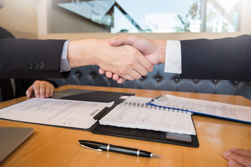 Business, career and placement concept, boss and employee handshaking after successful negotiations or interview.