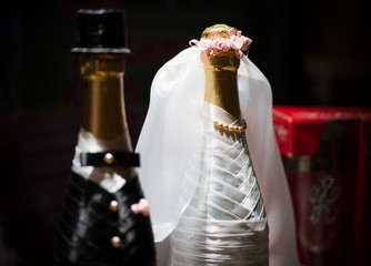 a bottle of champagne, decorated for the wedding.