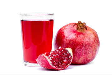 Glass of fresh healthy pomegranate juice, ripe pomegranate and clipping path with red seeds isolated on white background