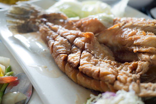 Deep fried snapper topped with sweet fish sauce