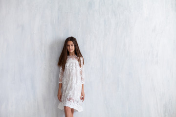 fashion girl 12 years old in a white dress