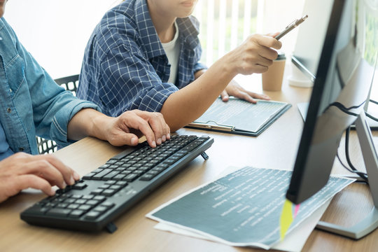 IT office Programmers software development coding technologies On Computer working in a company office