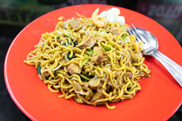 Indonesian stir-fried noodles (Bakmi Goreng) with chicken or seafood, a street-food noodle classic from Java island. 