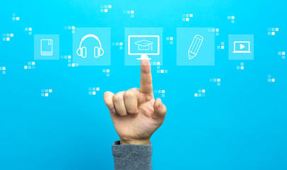 E-Learning with hand on a blue background