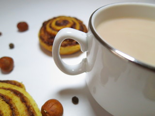 Cup of cocoa and twisted cinnamon cookies