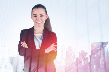 Smiling young businesswoman in morning city