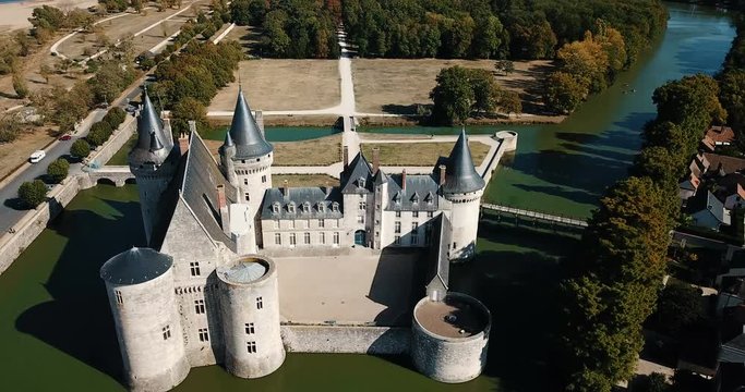 Aerial view of countryside of commune of Sully-sur-Loire with medieval fortified castle, France