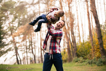 Fototapeta premium Father and son together in forest