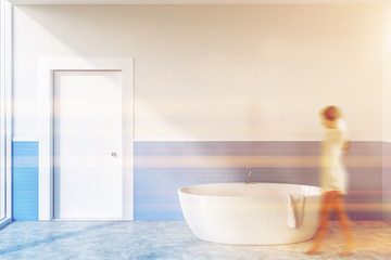 Woman in white and blue bathroom