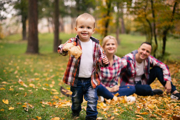 Family on weekend. Mother father and son in park