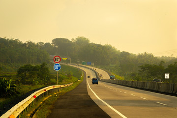 A speeding car going on the highway in Semarang, Indonesia 