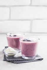 Frozen cherry coconut smoothie. Selective focus, space for text.