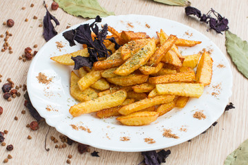  fried potatoes on a white spice plate
