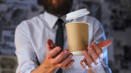 Barista and levitating paper cup of hot coffee