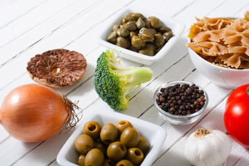 mediterranean food ingredients on white wooden