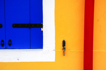 Abstract closeup of a window shutter in Burano, Italy