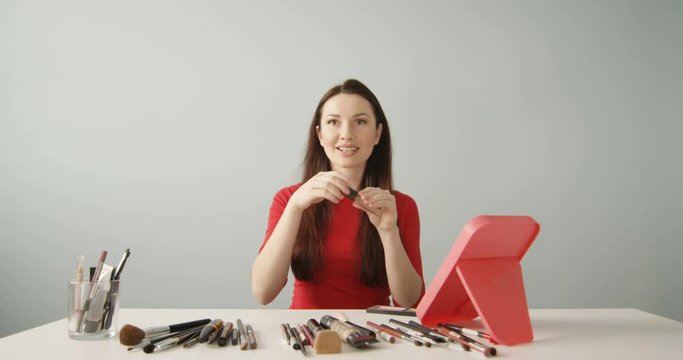 Beautiful Vlogger or Blogger Doing Cosmetic Makeup Tutorial with Brush Recording Viral Clip to Share on Social Media Shot on Red Camera 