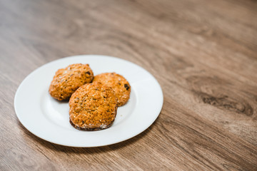  Oatmeal cookies on a plate are located on the table