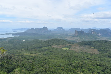 Fototapeta na wymiar Panorama view from a big rock over Krabi at the jungle hiking trail to dragon crest in Khao Ngon Nak in Krabi, Thailand, Asia