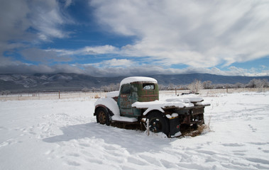 Rusted, Vintage Truck Frosted with Snow Abandonned in Snow Field