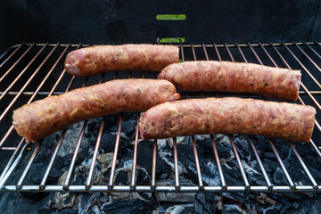 Roasted sausage on the grill.