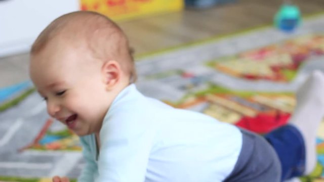 Little baby man is played in the home