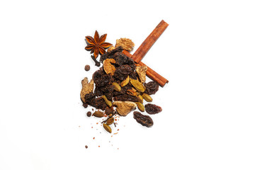 Fragrant spices for making hot winter drink - mulled wine: cinnamon sticks, anise stars, spicy ingredients from dried organic seasoning in a handful on a white background.