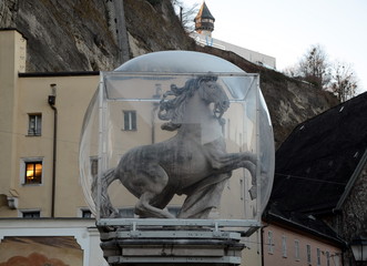 Ancient Horse sculpture, protected by a glass ball. Salzburg, Austria