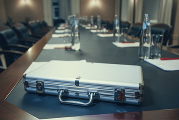 aluminum metal money case/ Closed aluminum metal money case on the table in the conference room
