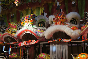 Chinese tradition lion mask or lion head displayed on rack. It is used to performed lion dance...