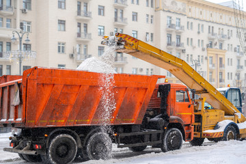 snow plow removing snow from the road b