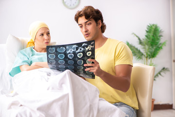 Husband looking after wife in hospital 