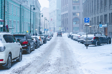 wnter urban side street. foggy day. deserted side street snowfall in winter city f