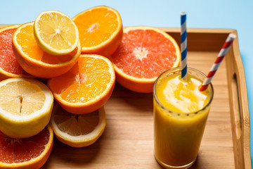 cut in half juicy citruses on a blue background