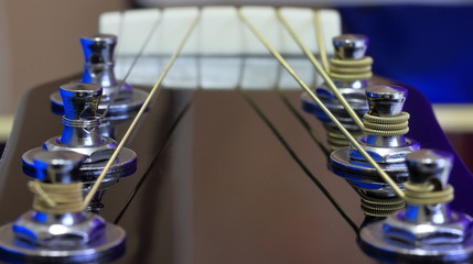 A close up color image of a 6 string guitar headstock.