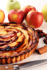 Naklejka na ściany i meble Apple tart. Gourmet traditional holiday apple pie sweet baked dessert food with cinnamon and apples on table