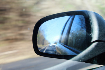 Fototapeta premium Car wing mirror in motion