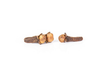 Group of two whole small dried cloves spice isolated on white background