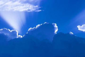 Rays of light falling on the icy clouds above