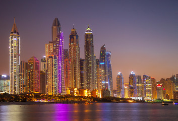 Fototapeta na wymiar View Ffrom Promenade on Dubai Marina Modern Towers in the Evening